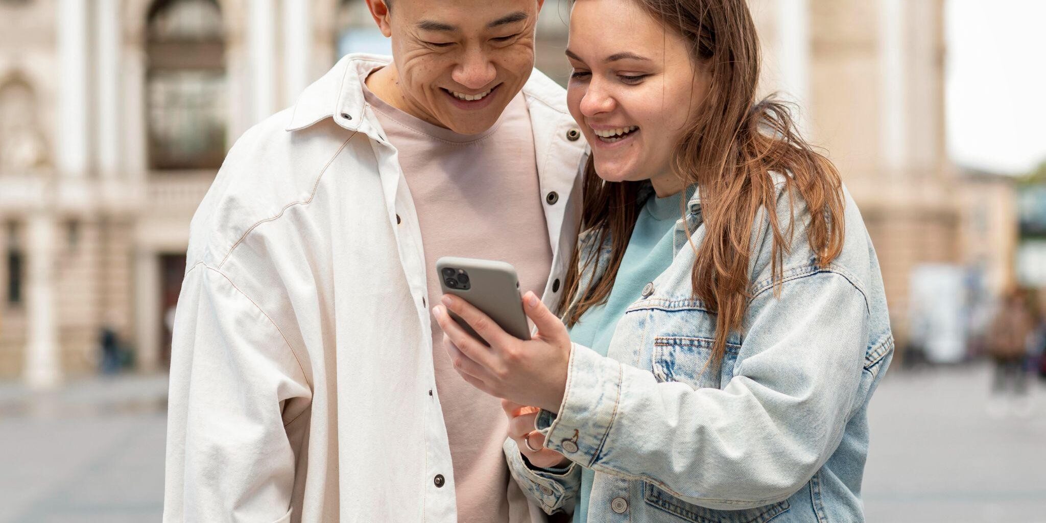 Man and woman looking at phone